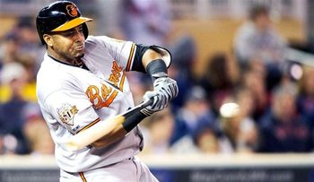 Cruz y De Aza conducen a los Orioles a su primera victoria