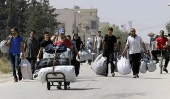 "Evacuan" a 350 personas de un barrio sitiado en Homs, Siria