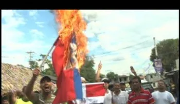 Apresan a seis por quema de bandera haitana en Santiago