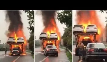 Un conductor rescata un coche desde un camión remolcador en llamas