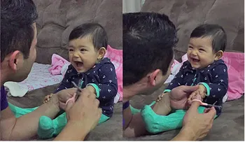 Una bebé asusta a su papá cuando él intenta cortarle las uñas