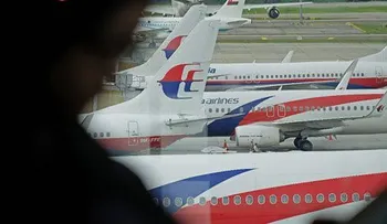 Familias de víctimas chinas de avión de Malasia insatisfechas con datos