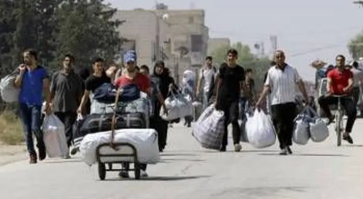 "Evacuan" a 350 personas de un barrio sitiado en Homs, Siria