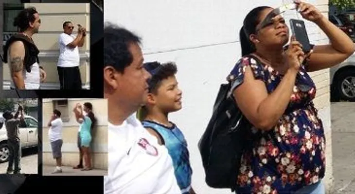 Dominicanos observan eclipse en NY desde calles, ventanas, azoteas y parques