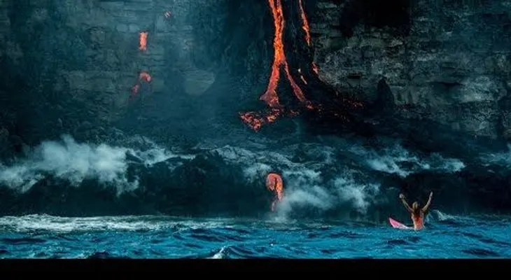 La "mujer de Indiana Jones" surfea a pocos metros de un volcán en plena erupción