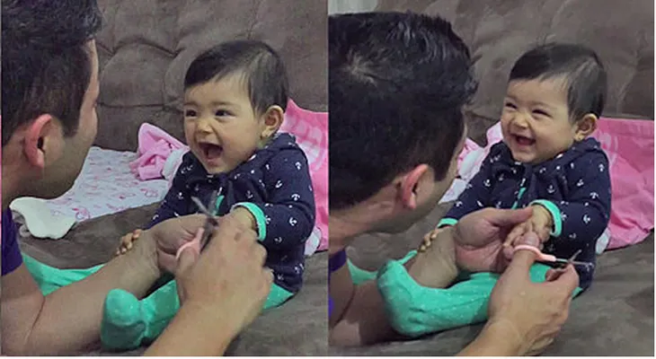 Una bebé asusta a su papá cuando él intenta cortarle las uñas