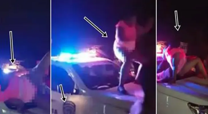 Mujer se sube en camioneta de patrulla, con el vestido encima y baila de forma provocativa