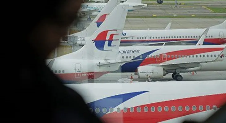 Familias de víctimas chinas de avión de Malasia insatisfechas con datos